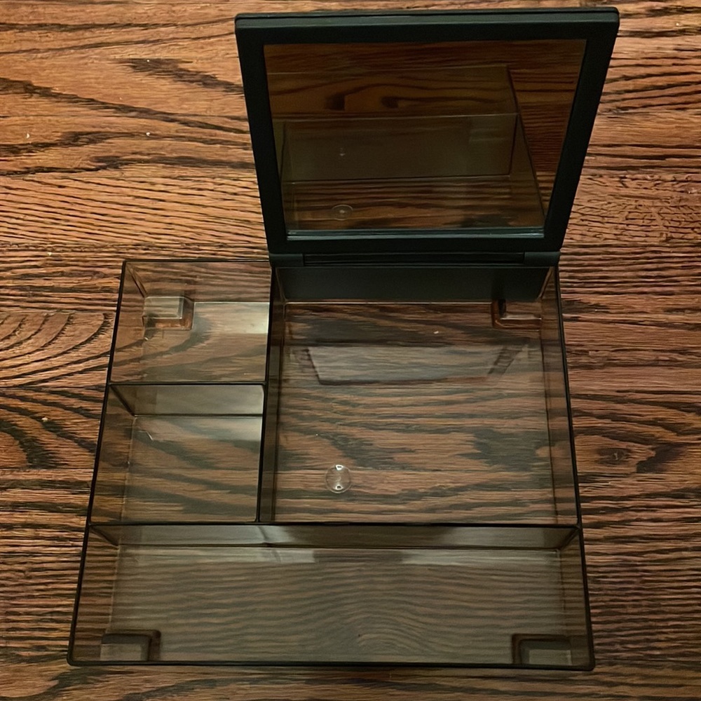 Acrylic accessory/jewelry tray with mirror. Approx 7.5 x 6.5 x1.5 inches.